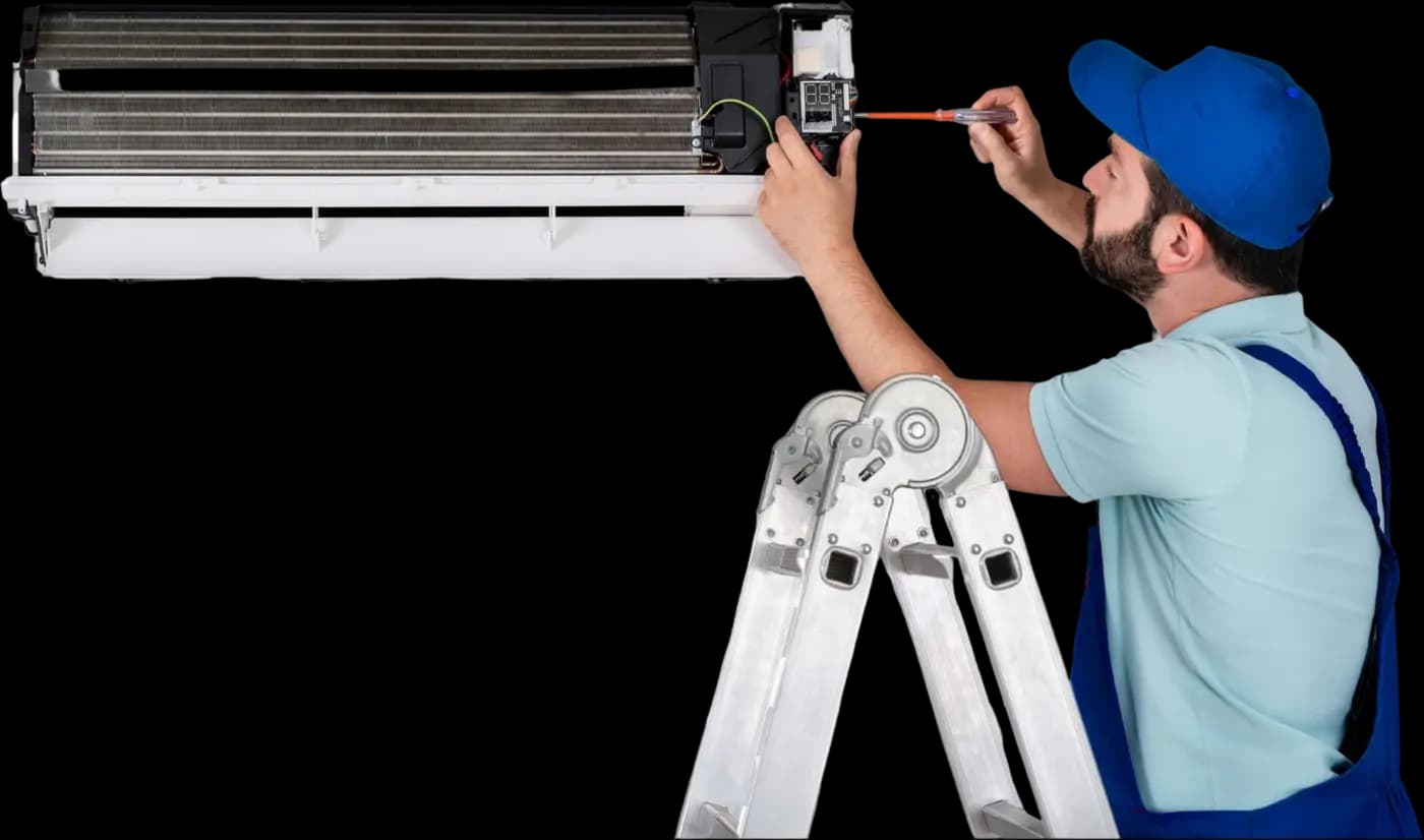 Technician inspecting an opened air-conditioning indoor unit